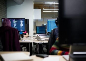 A team going over relationship mapping software