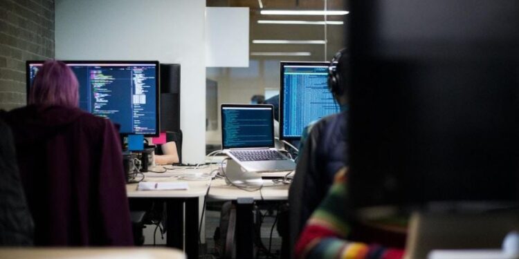 A team going over relationship mapping software